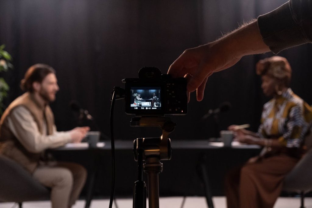 Professional podcast session recording with diverse hosts in studio.